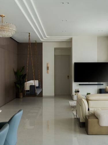 Living room with hanging swing chair, wall-mounted TV, and crystal chandelier over polished floor
