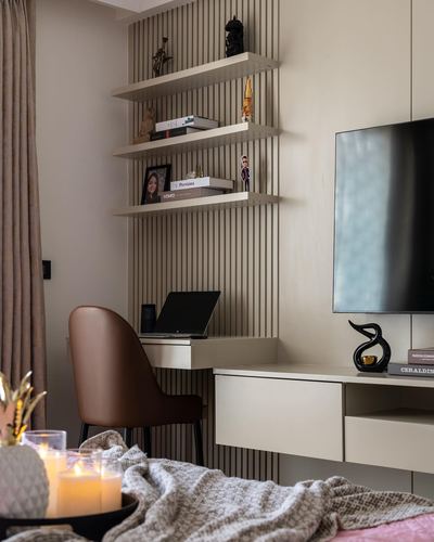 Study nook with fluted panelling, floating shelves, leather chair and wall-mounted TV console