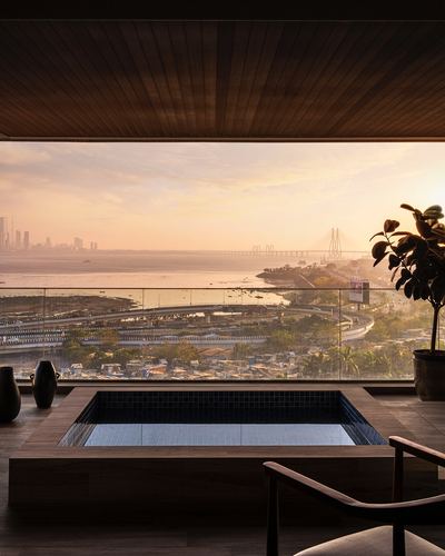 Rooftop deck with sunken plunge pool overlooking Arabian Sea and Bandra-Worli Sea Link at sunset