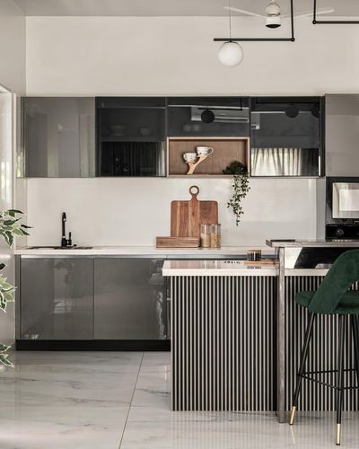 Grey gloss modular kitchen with fluted island, marble countertop and wooden accessories
